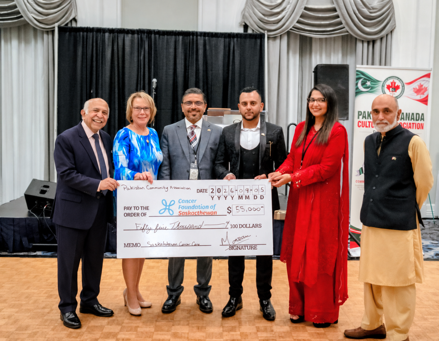 PCAS representatives presenting a $55,000 cheque to the Cancer Foundation of Saskatchewan at the 2026 Pakistani Night Gala